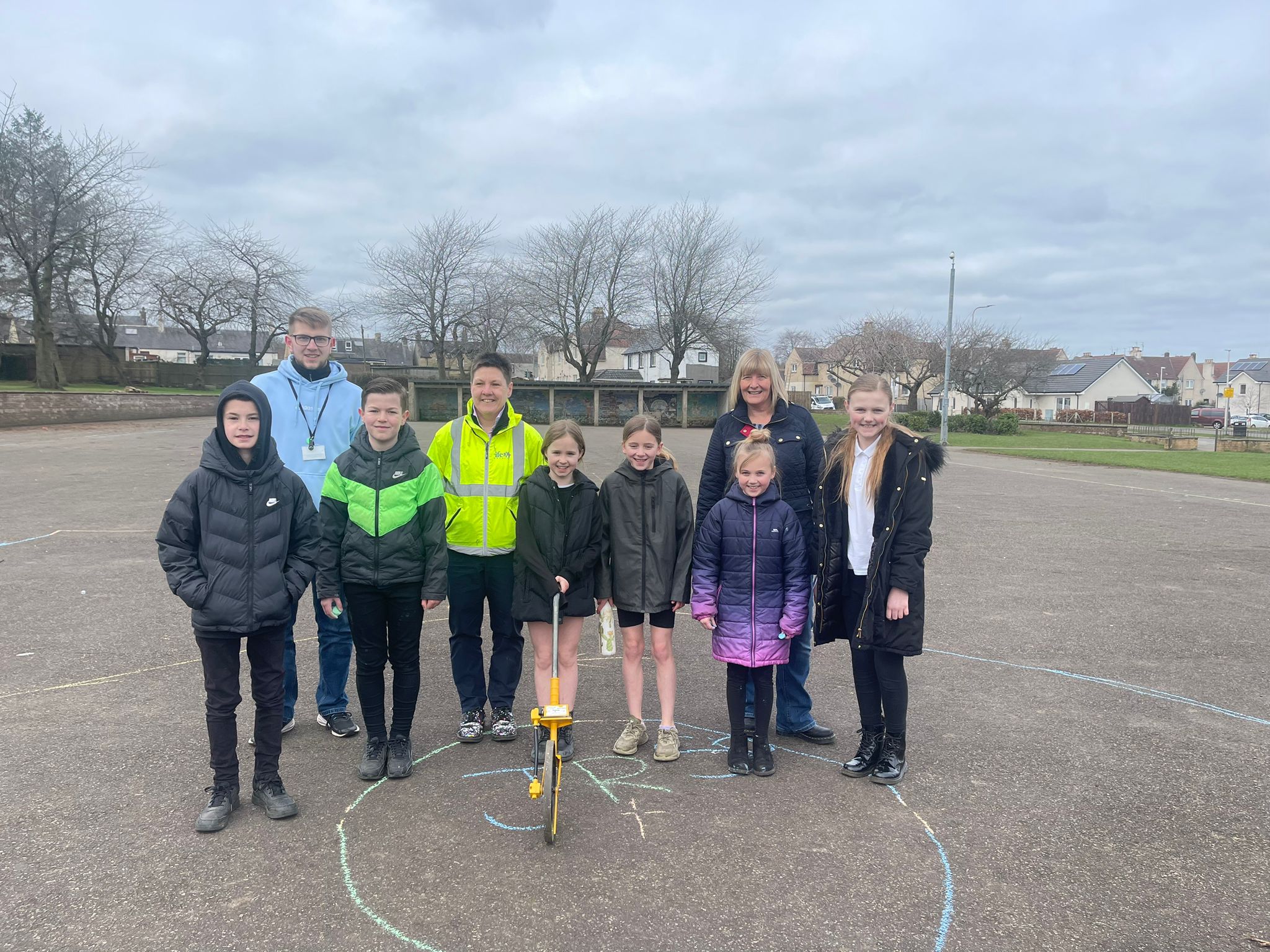 Carleton Primary school children with Marta Ramage, Shealagh Crabb and Kieron Clark Burns measuring up 